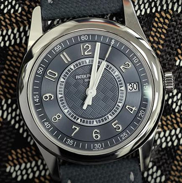 Silvery Blue Patek Philippe Calatrava against a classic black/gold/white Goyard background. This watch is limited to 1000 pieces.